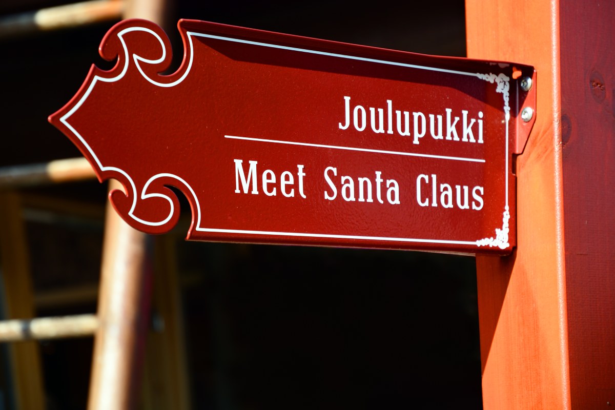 sign to the entrance to santa claus village 