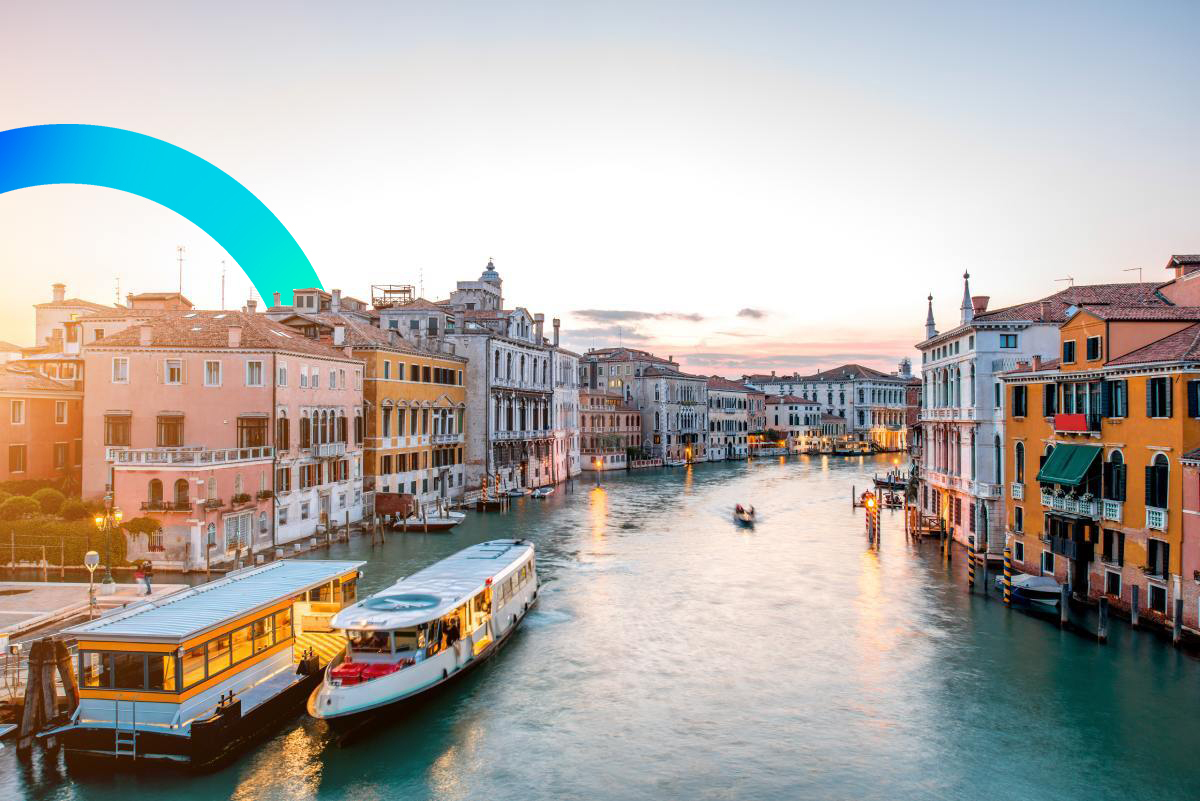 Beautiful Venetian buildings and a water tram © iStock