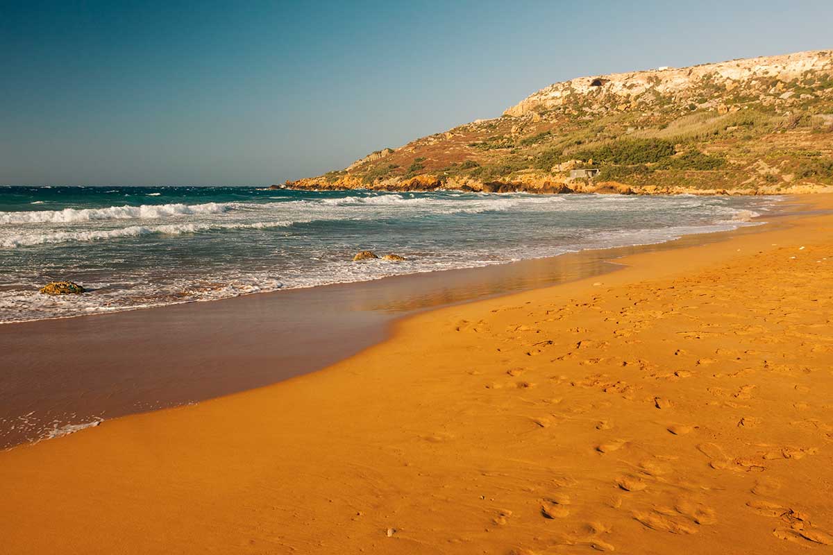 A red sand beach on Gozo