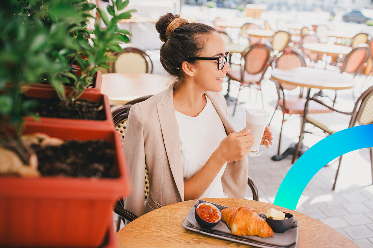 Woman enjoying croissant in Paris © iStock