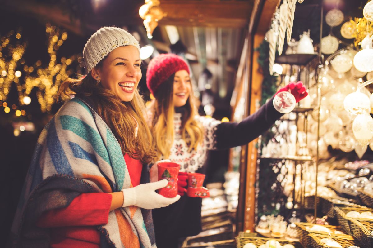 Women enjoying christmas decorations © iStock